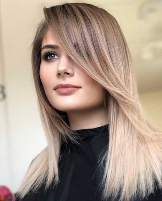 Longue frange oblique et cheveux longs