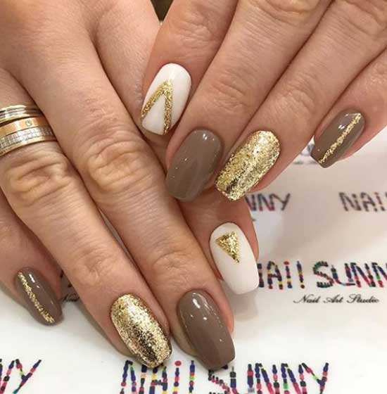 Manucure dans les tons marron et or