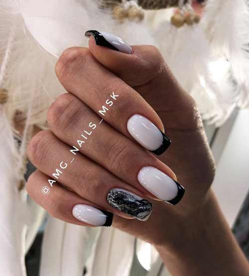 Veste noire et blanche avec de l'argent