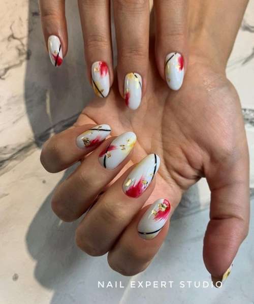 Manucure feuille rouge et lait